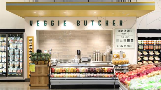 The new Whole Foods features a “veggie butcher” who cuts fruits and vegetables to order. 