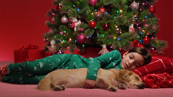 Target holiday ad with boy and Christmas tree.